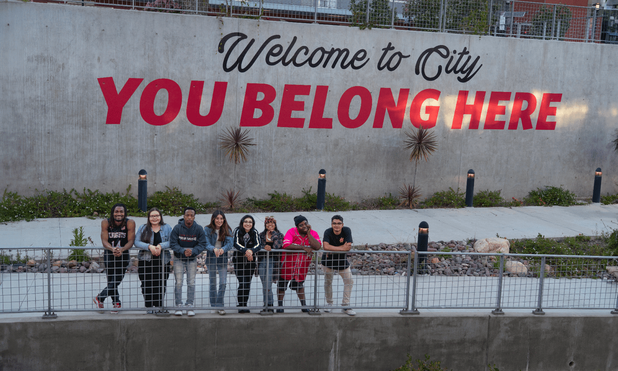 You Belong Here Students standing in front of You Belong Here sign on the City College campus