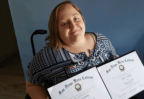 Taylor Carpenter holds her two diplomas from Mesa College