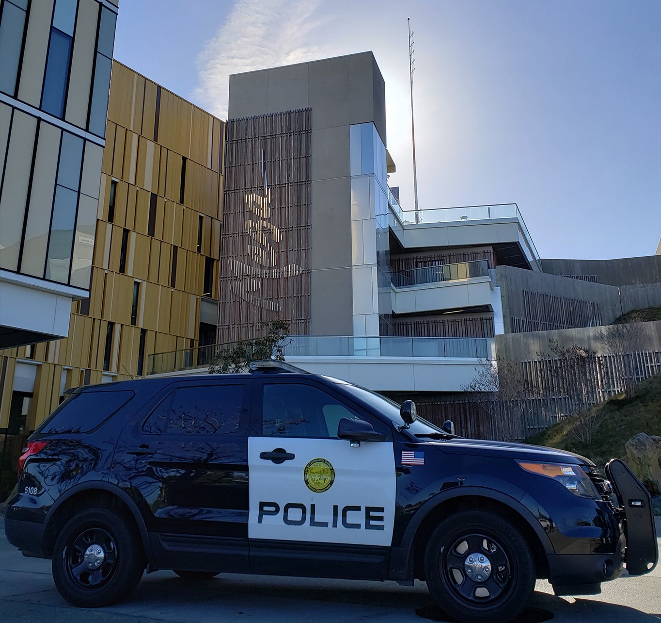 College Police SUV parked in front of Mesa College's Student building