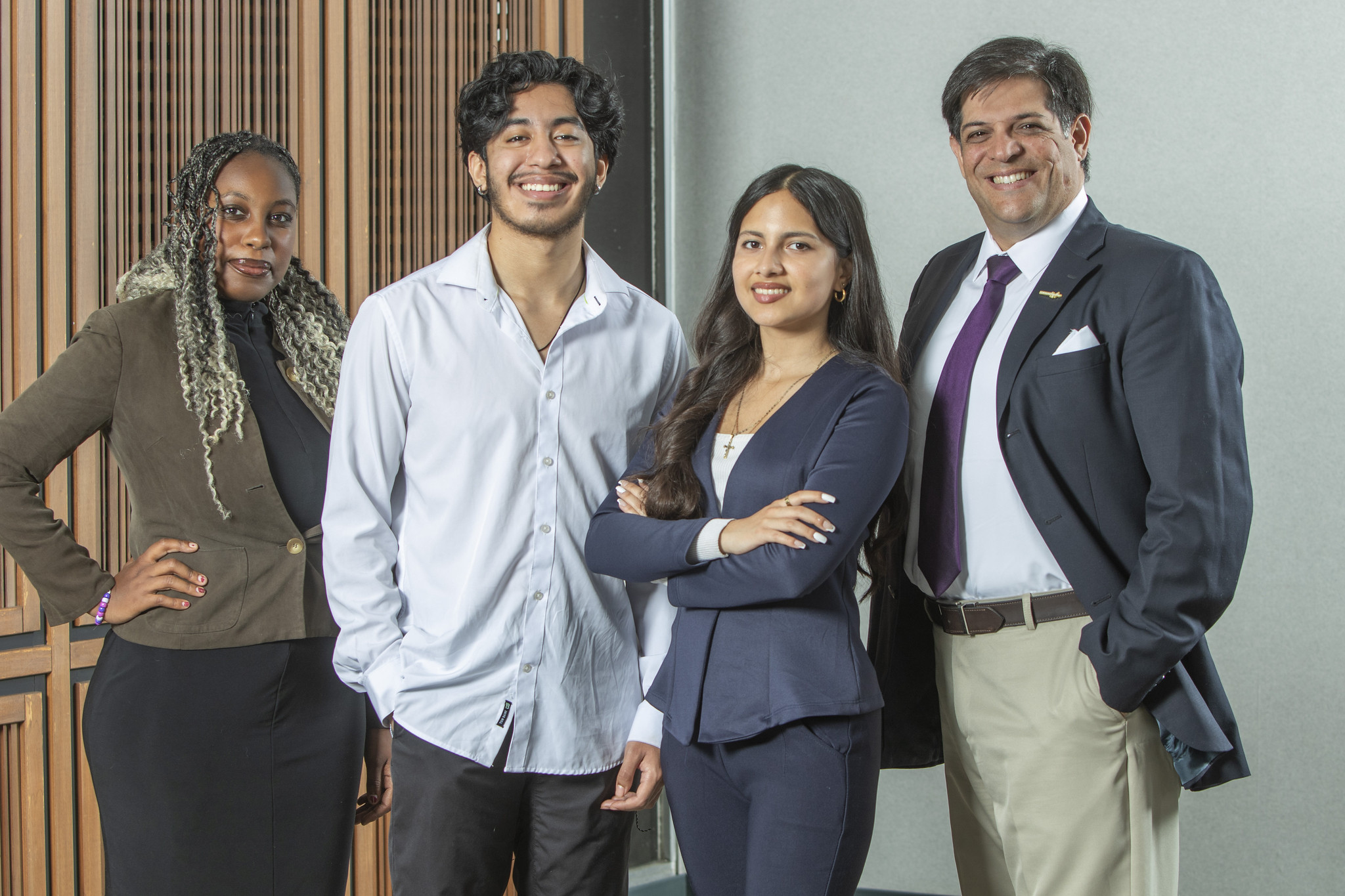 Four student trustees on the lobby of the district office