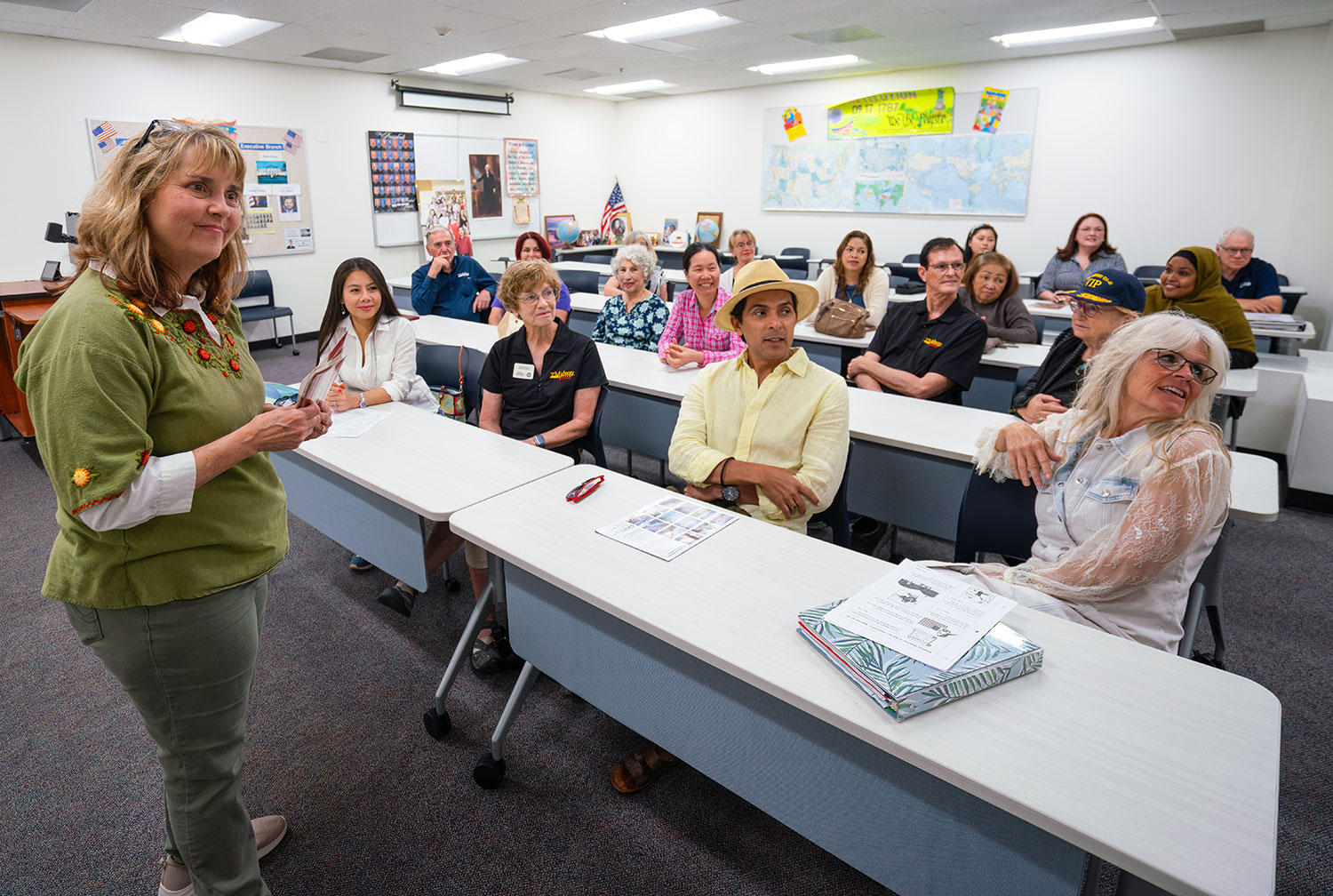 Mechelle Perrott (left) provides instruction to students and volunteers in a classroom
