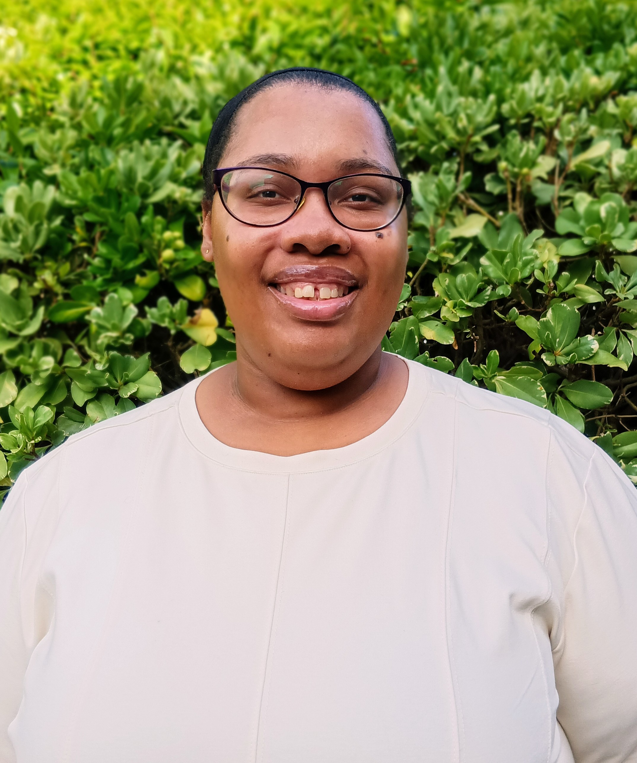 joy miller glasses white shirt hair slicked back