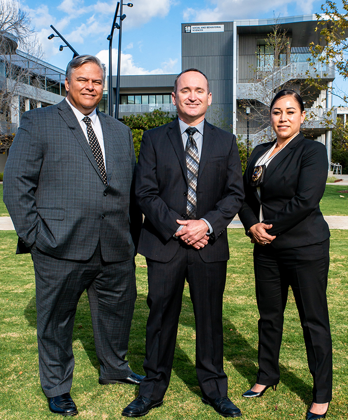 Three college police detectives