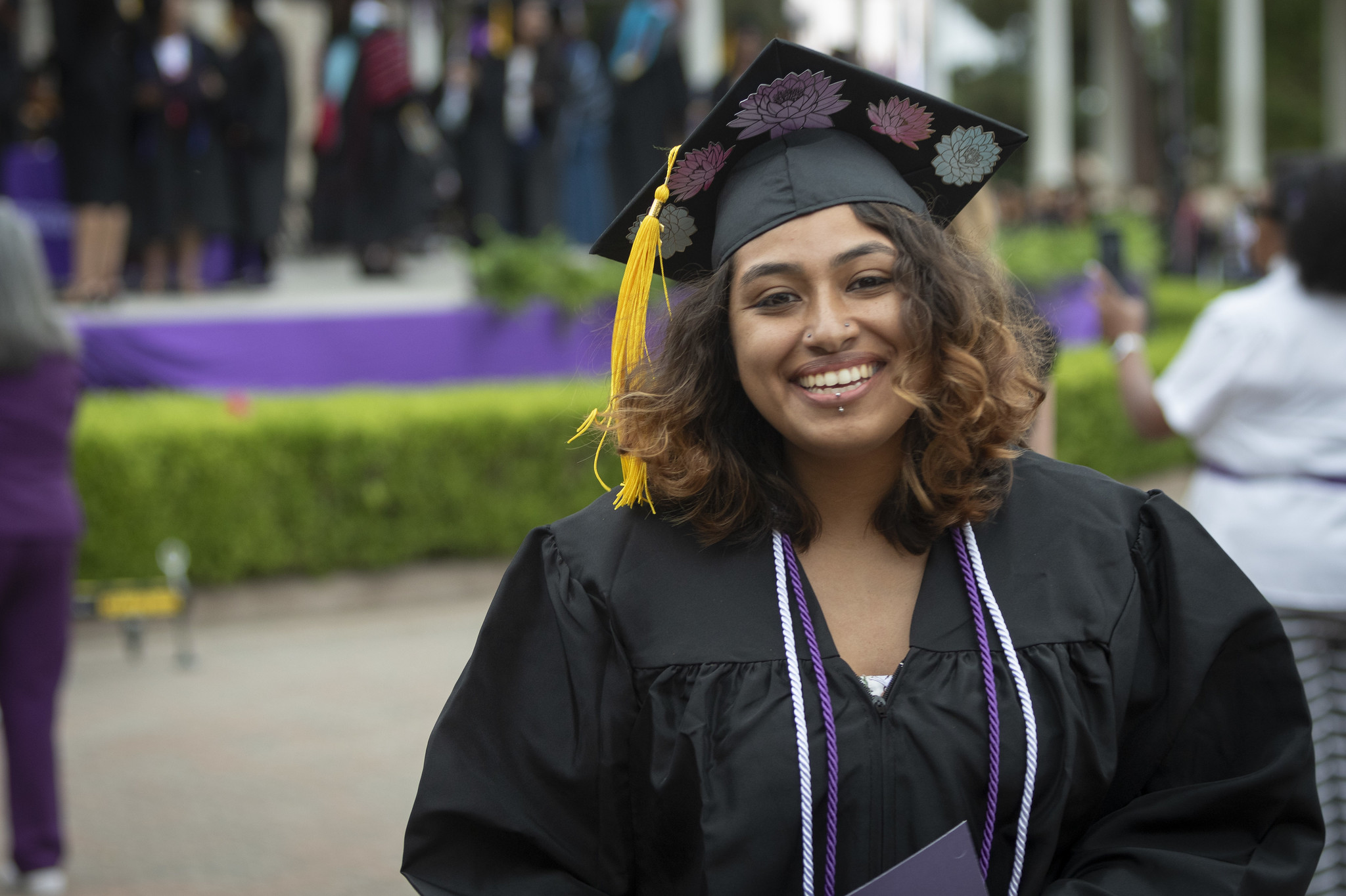 
A graduate smiling after receiving her certificate.
