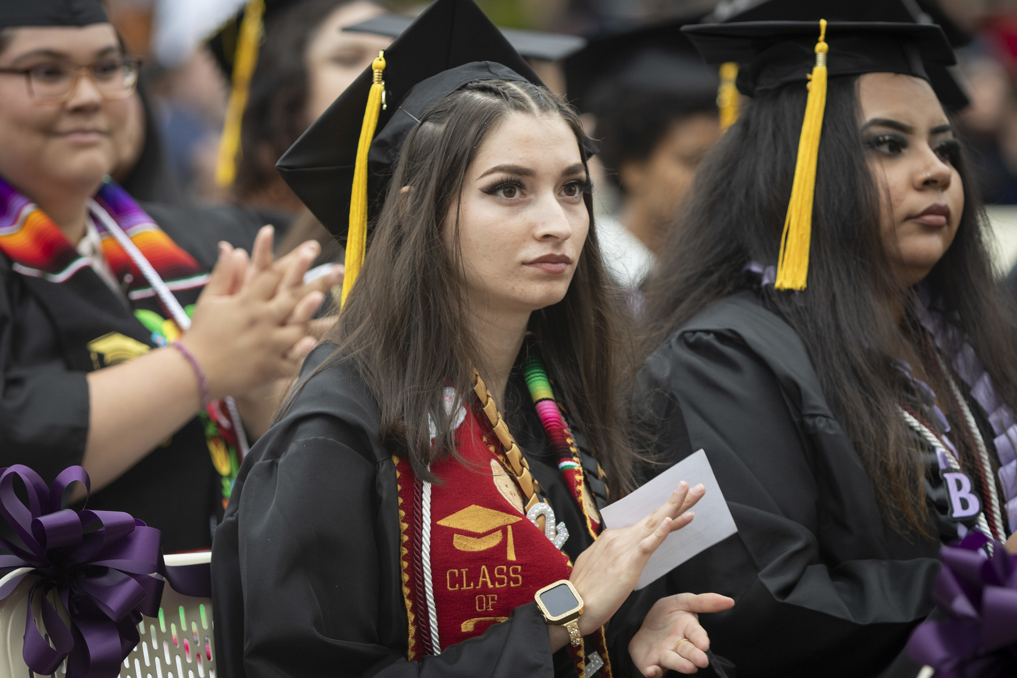 
Graduates seated in the crowd.
