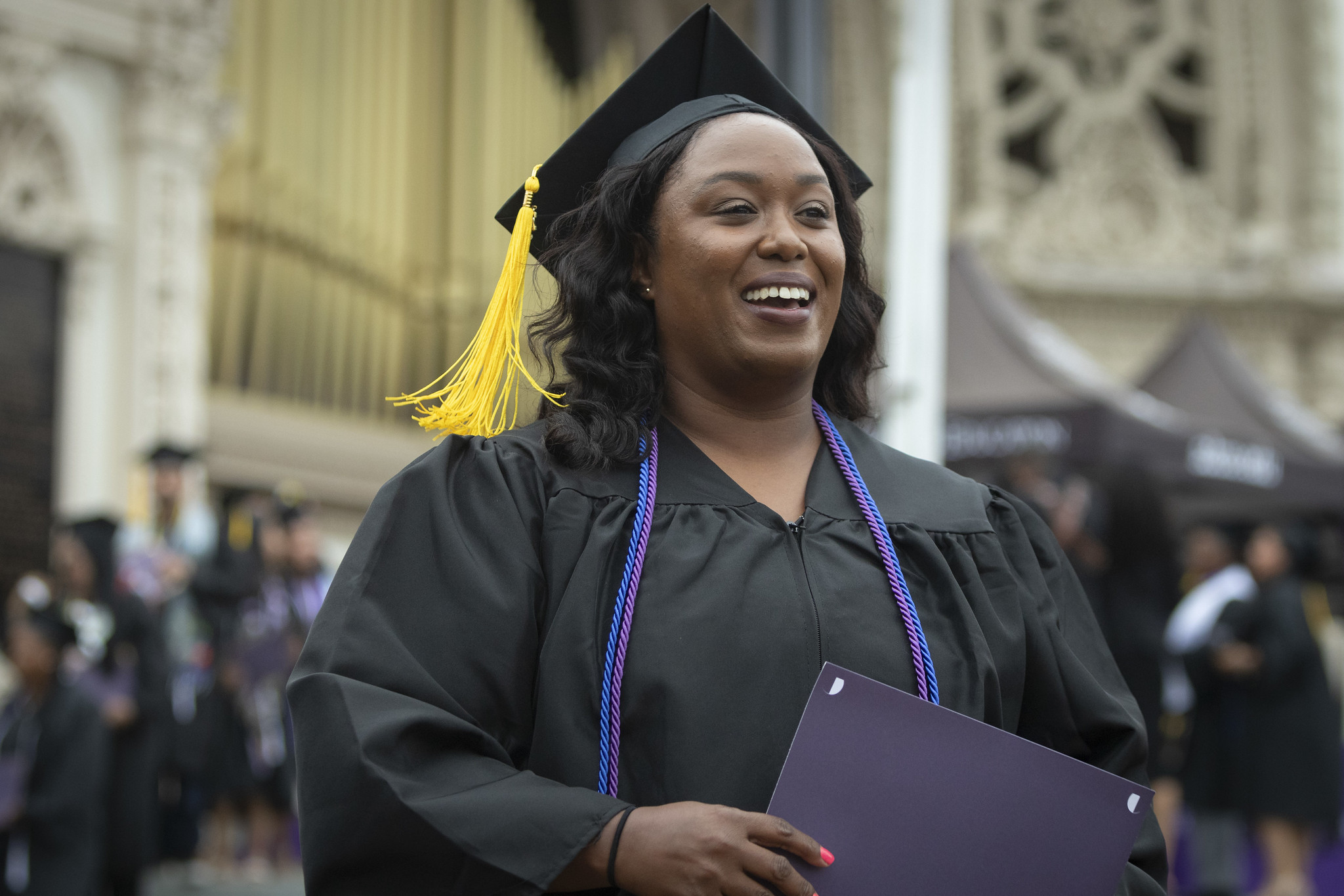 
A graduate smiling after receiving her certificate.
