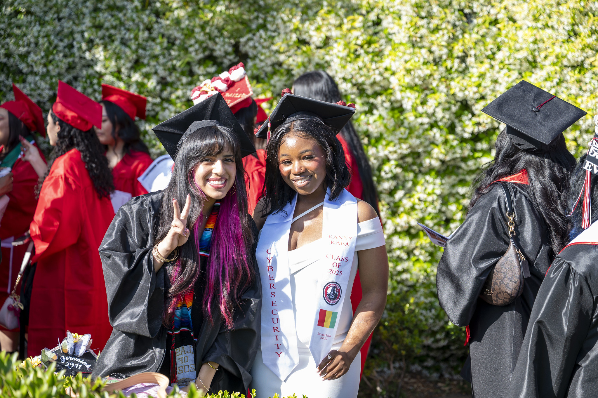 
Two graduates waiting for the ceremony to start.
