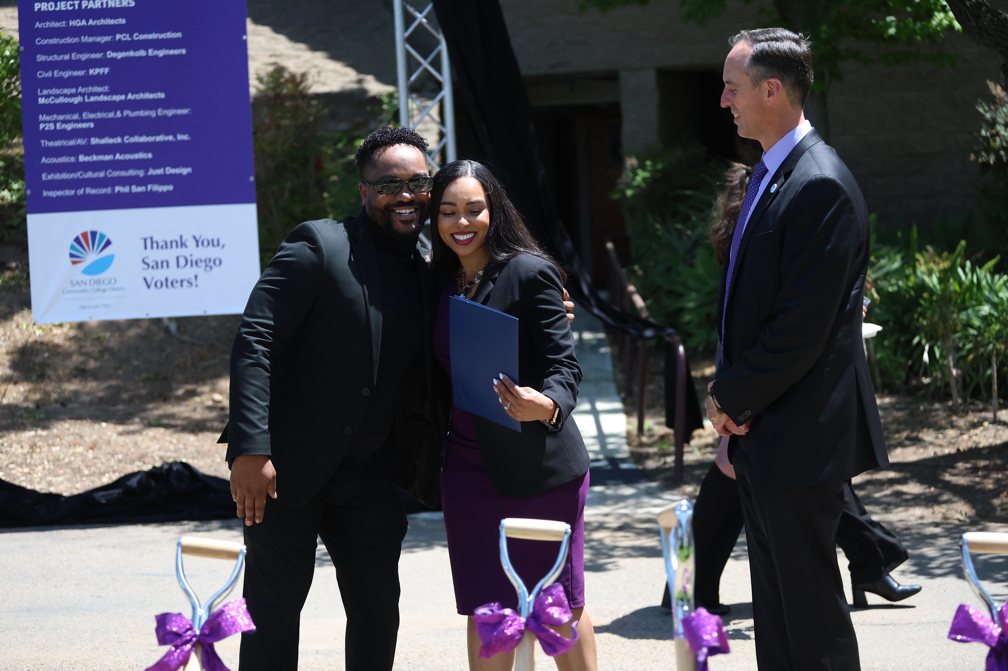 
Dr. Tina King hugs someone at the event. Chancellor Gregory Smith looks on.

