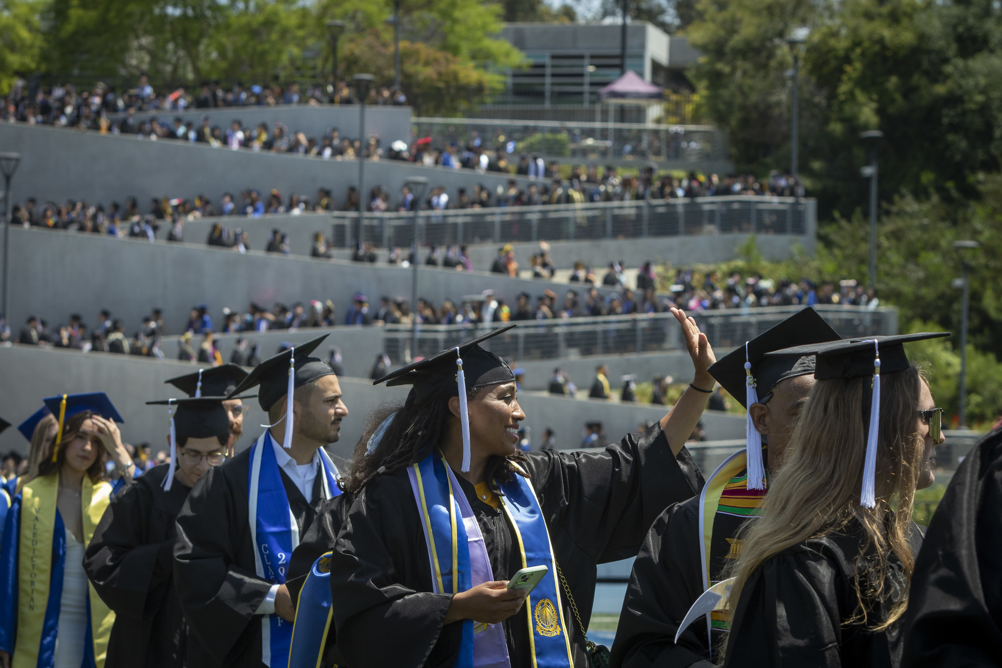 
A student waves to the crowd.
