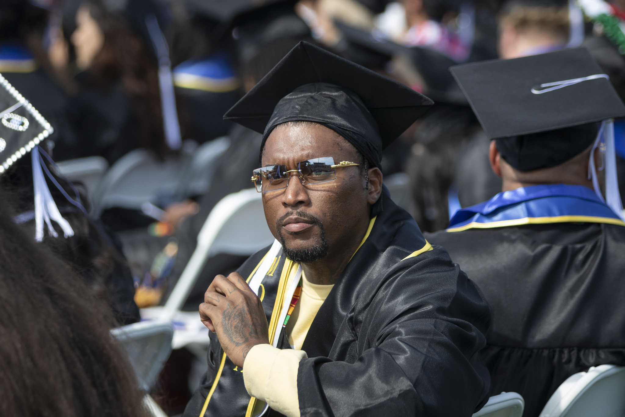 
A graduate seated in the audience.
