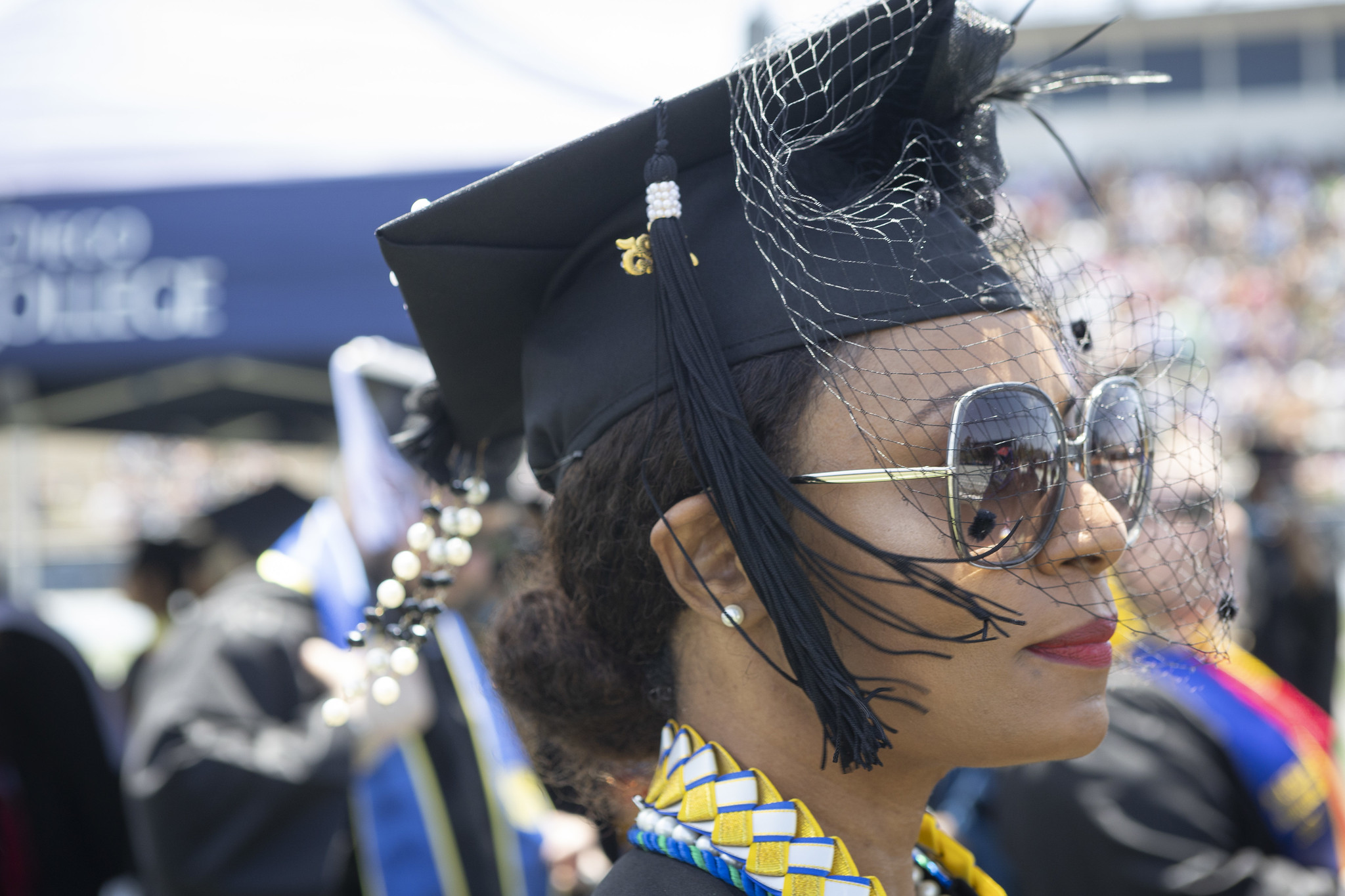 
A graduate seated at commencement.
