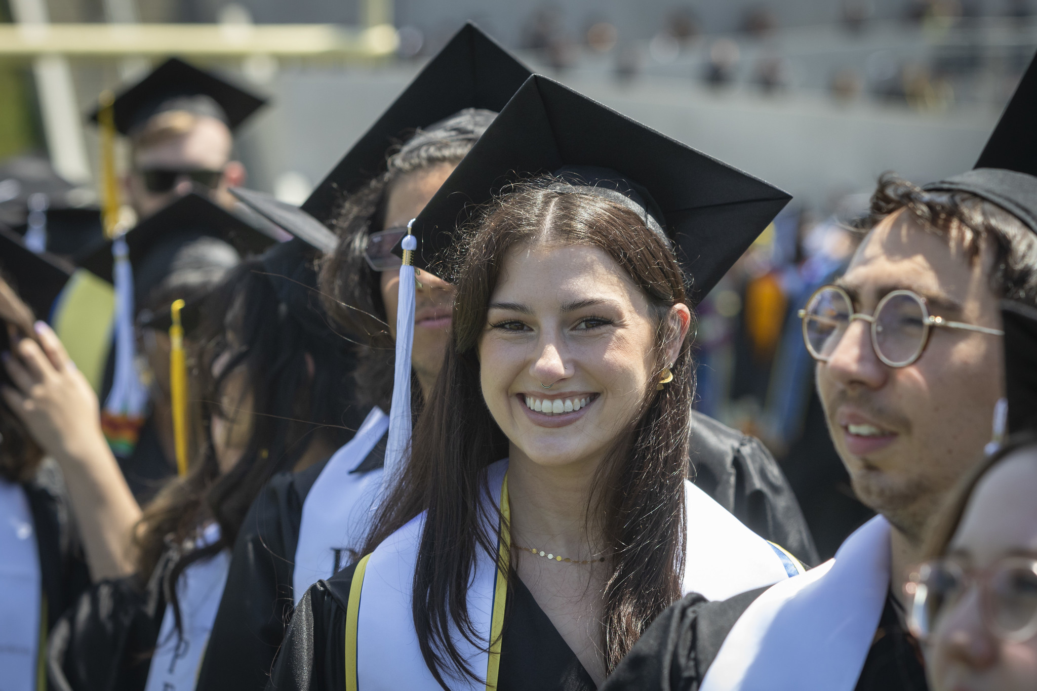
A graduate walks to her seat.
