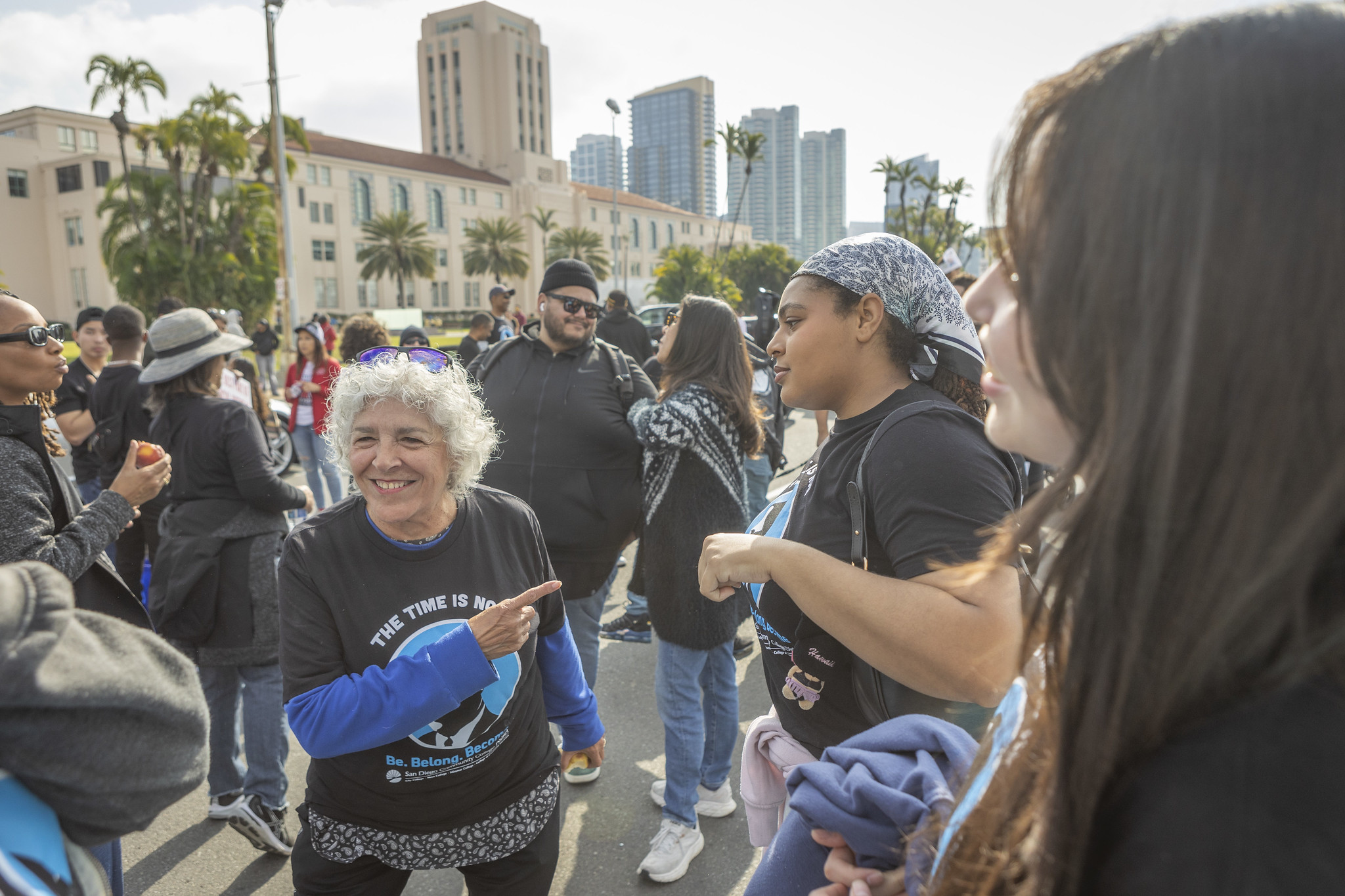 Trustee Maria Nieto Senour laughs with student trustee Zora Williams.