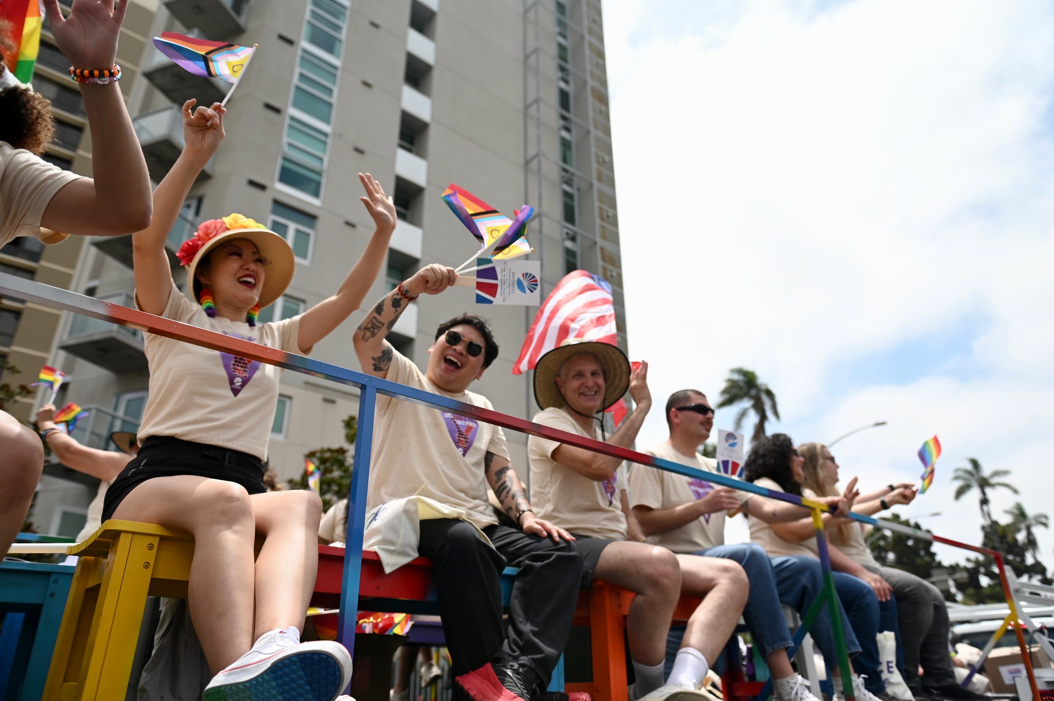 
Six people on the SDCCD float wave to the crowd.
