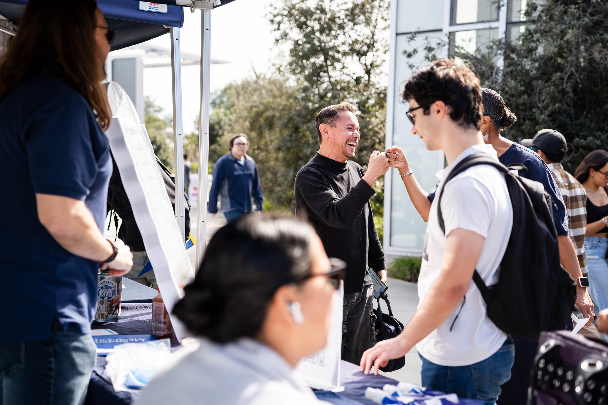 
Two men give a fist bump.
