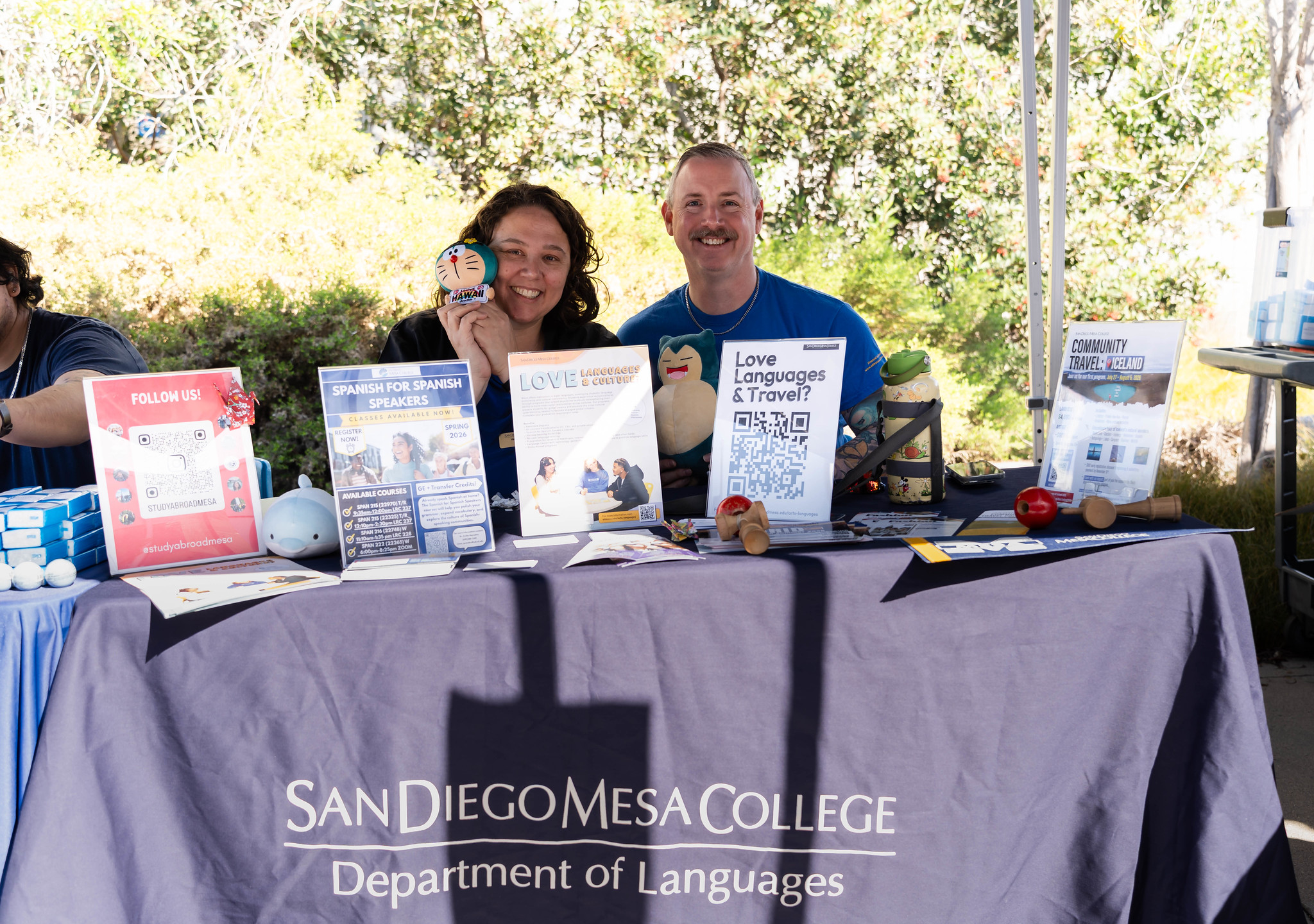 
Two people at the Mesa Department of Languages welcome booth.
