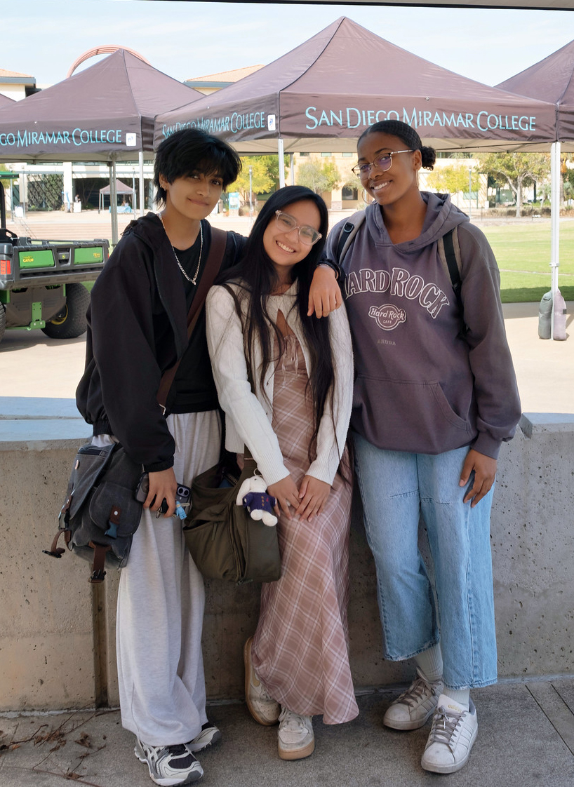
Three students near Miramar welcome tents
